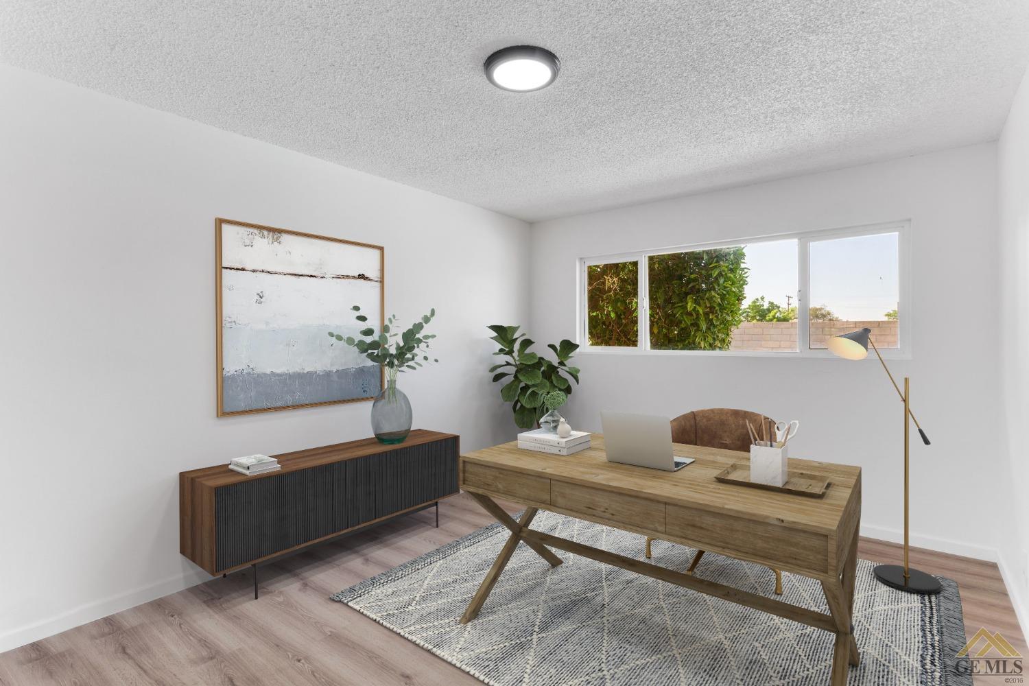 Undisclosed Address Bakersfield, CA 93308 - Photo 22 of 27 a living room with furniture