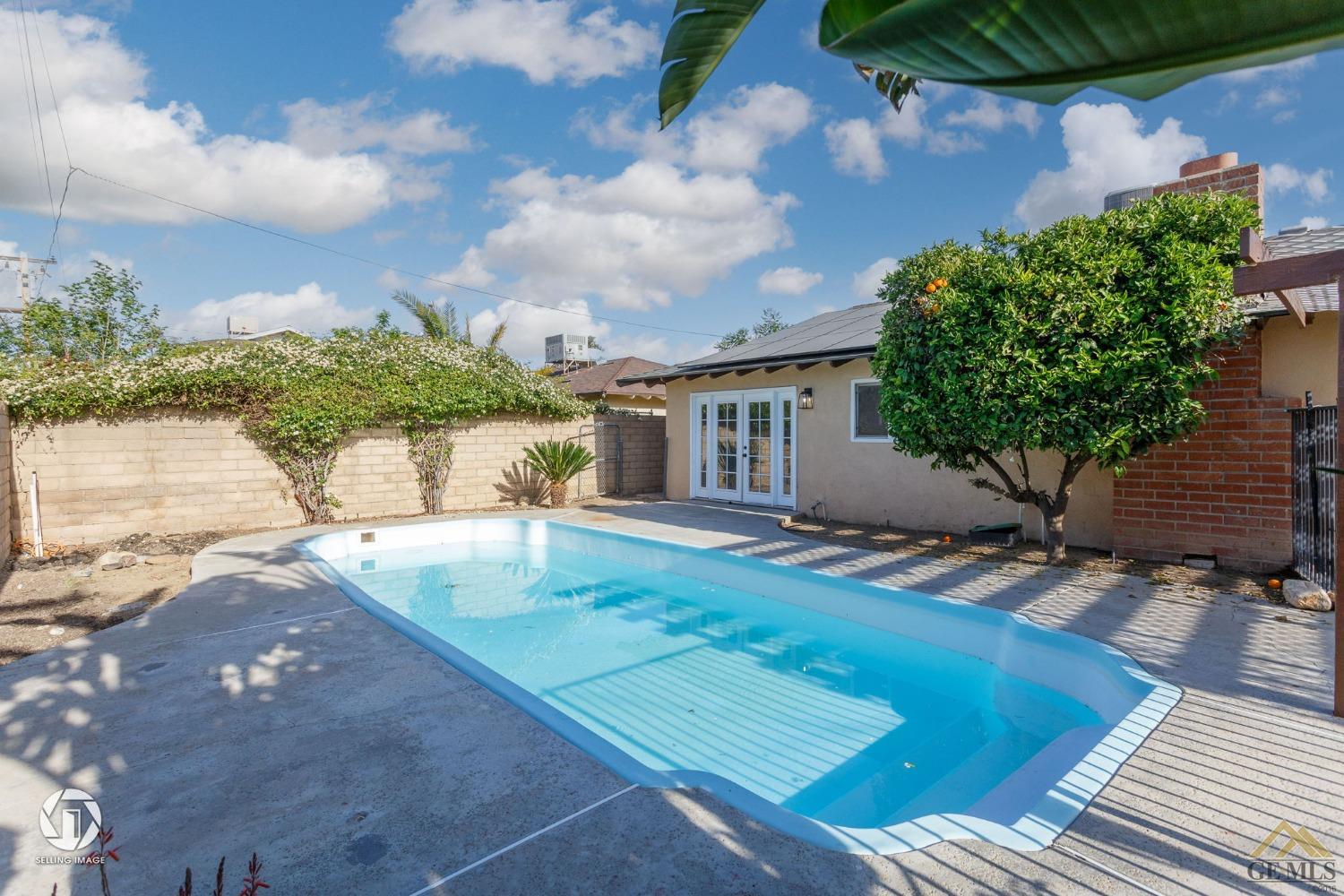 Undisclosed Address Bakersfield, CA 93308 - Photo 26 of 27 a view of a backyard with plants and a patio