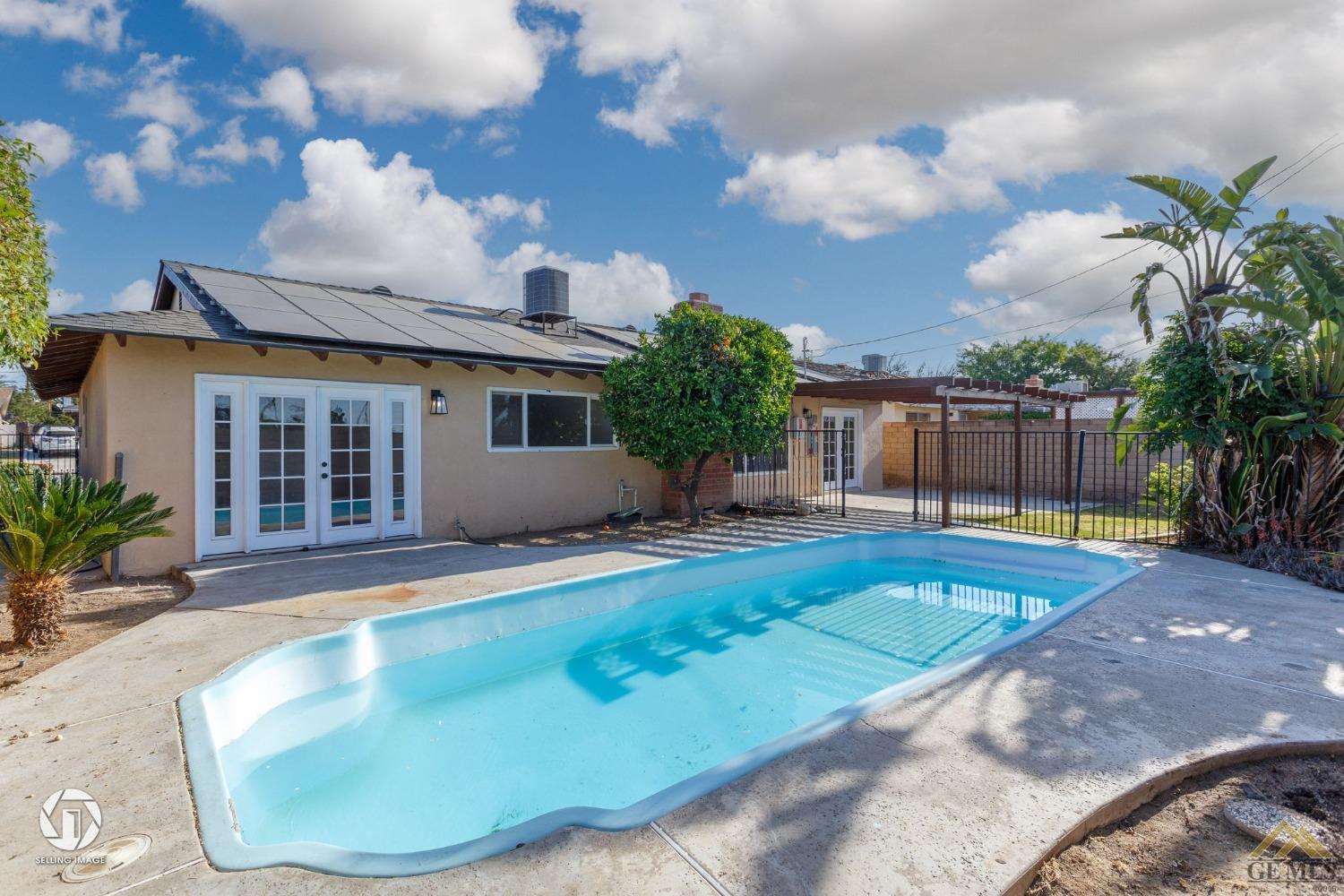 Undisclosed Address Bakersfield, CA 93308 - Photo 27 of 27 a view of a house with a swimming pool and sitting area