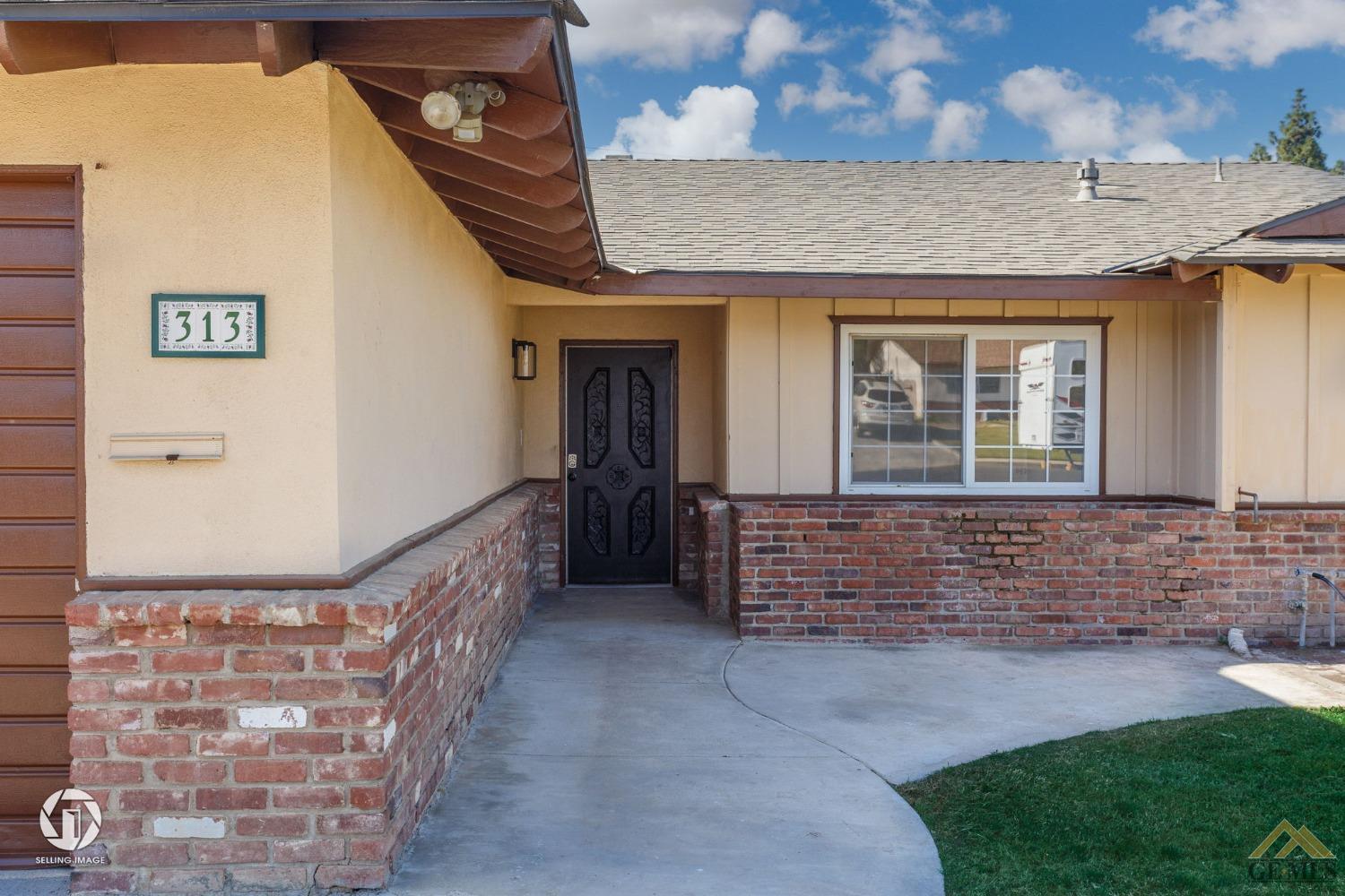 Undisclosed Address Bakersfield, CA 93308 - Photo 3 of 27 a view of front door of house with yard