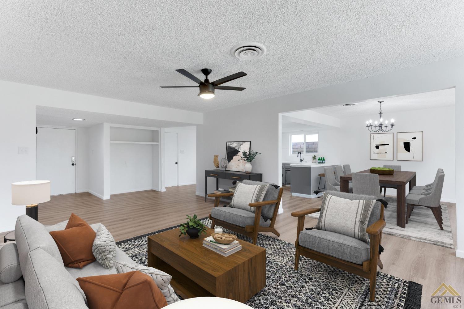 Undisclosed Address Bakersfield, CA 93308 - Photo 4 of 27 a living room with furniture ceiling fan and a rug