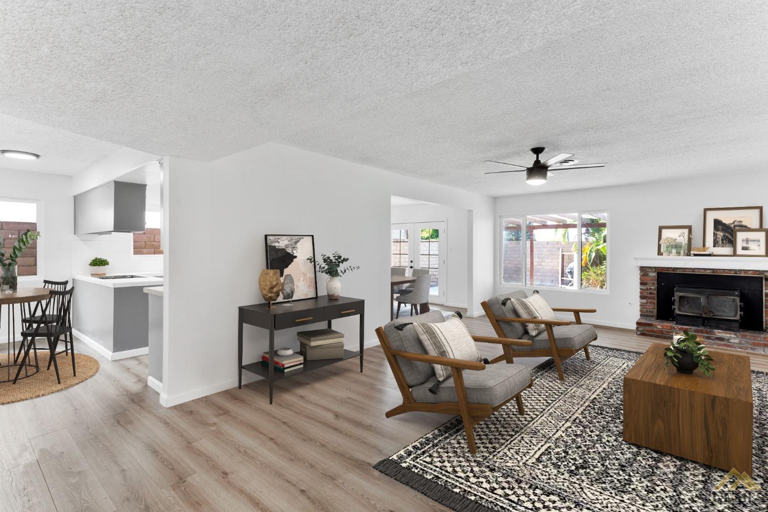 Undisclosed Address Bakersfield, CA 93308 - Photo 6 of 27 a living room with furniture and a fireplace