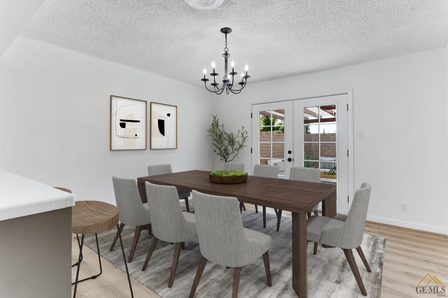 Undisclosed Address Bakersfield, CA 93308 - Photo 7 of 27 a view of a dining room with furniture a chandelier and wooden floor