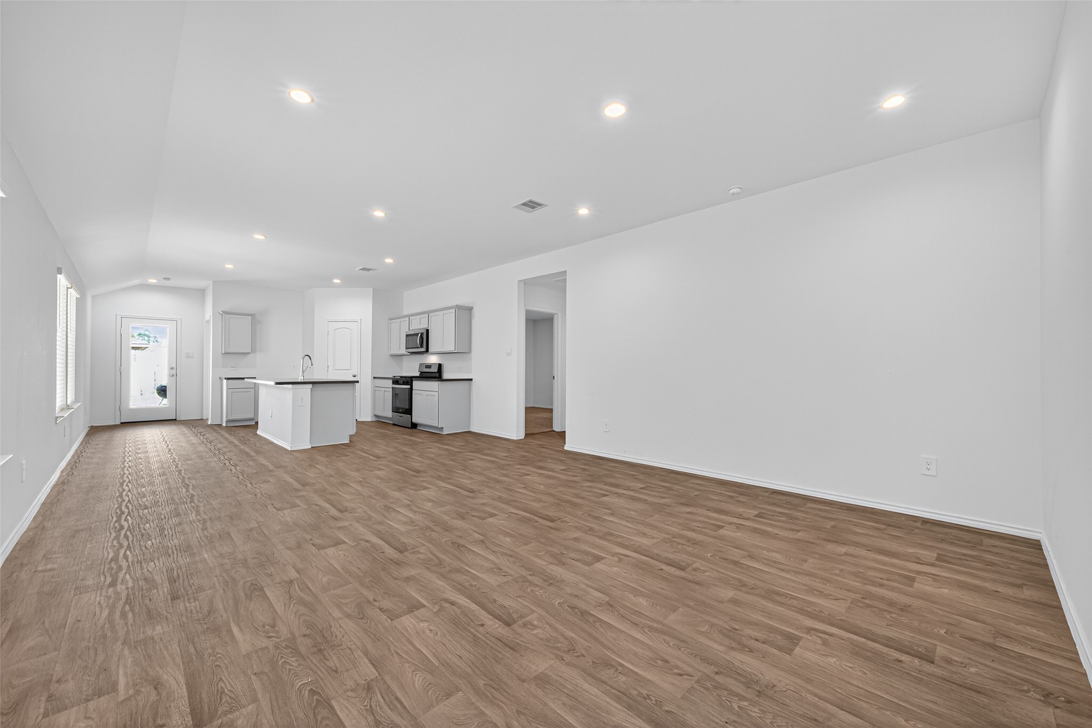 5343 Tuscany Hills Lane Spring, TX 77373 - Photo 7 of 32 Family room, Dining room, and Kitchen all open to each other