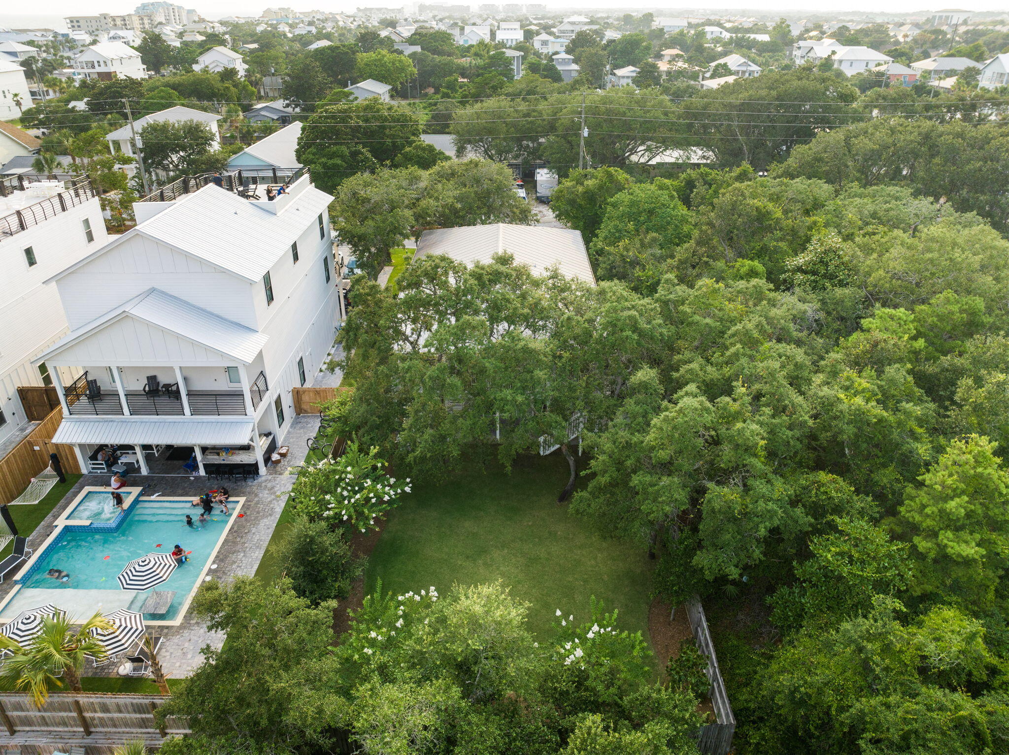 85 Dolphin Street Destin, FL 32541 - Photo 16 of 63 an aerial view of a house with a yard basket ball court and outdoor seating
