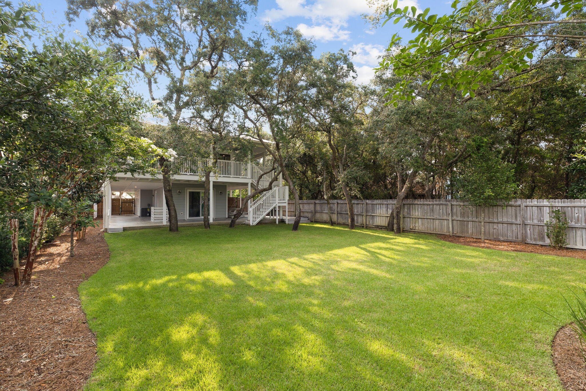 85 Dolphin Street Destin, FL 32541 - Photo 18 of 63 a view of a house with a backyard
