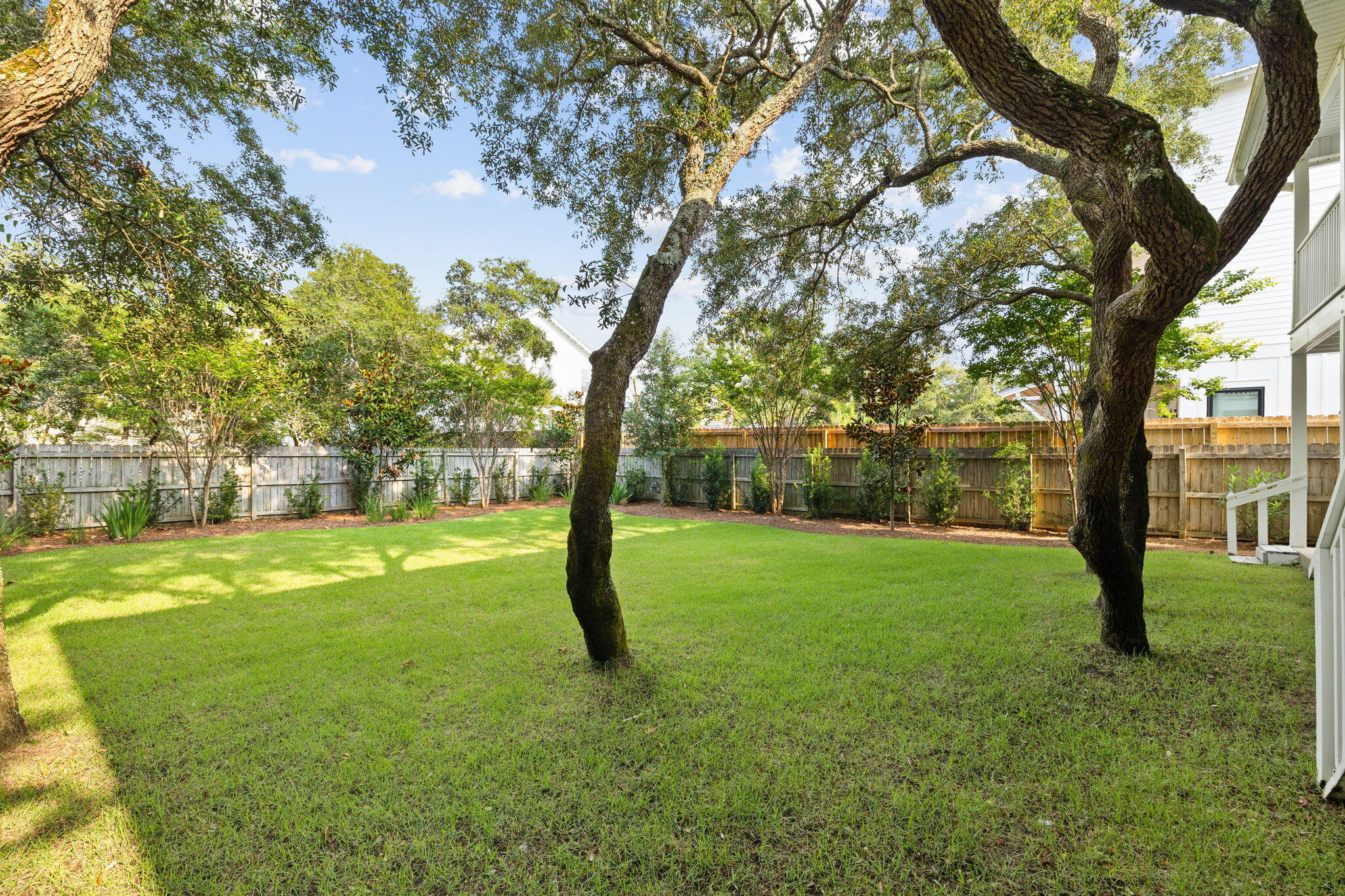 85 Dolphin Street Destin, FL 32541 - Photo 20 of 63 a view of a yard with a tree