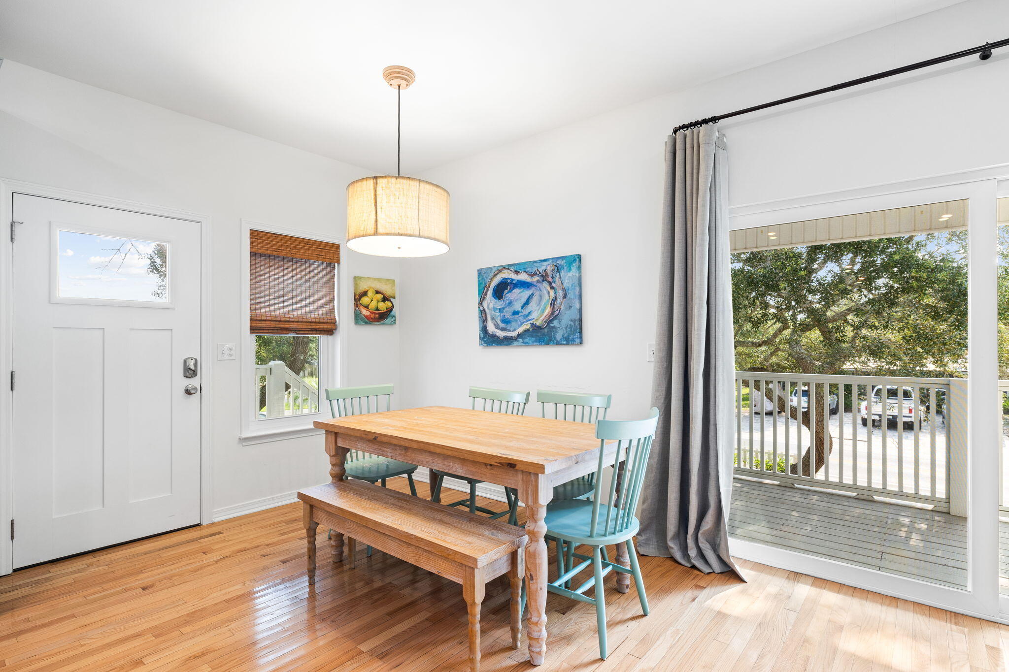 85 Dolphin Street Destin, FL 32541 - Photo 28 of 63 a room with chandelier and wooden floor