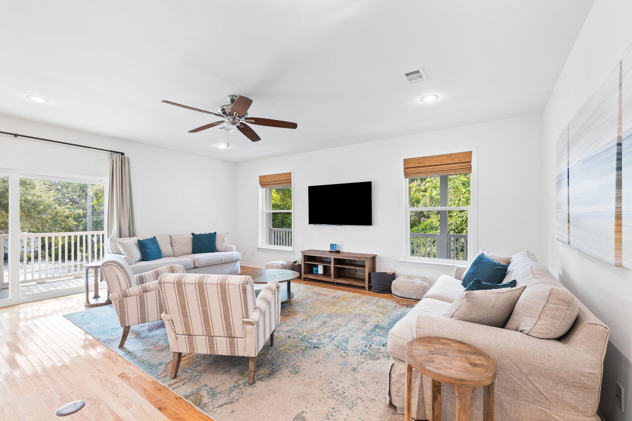 85 Dolphin Street Destin, FL 32541 - Photo 30 of 63 a living room with furniture and a flat screen tv