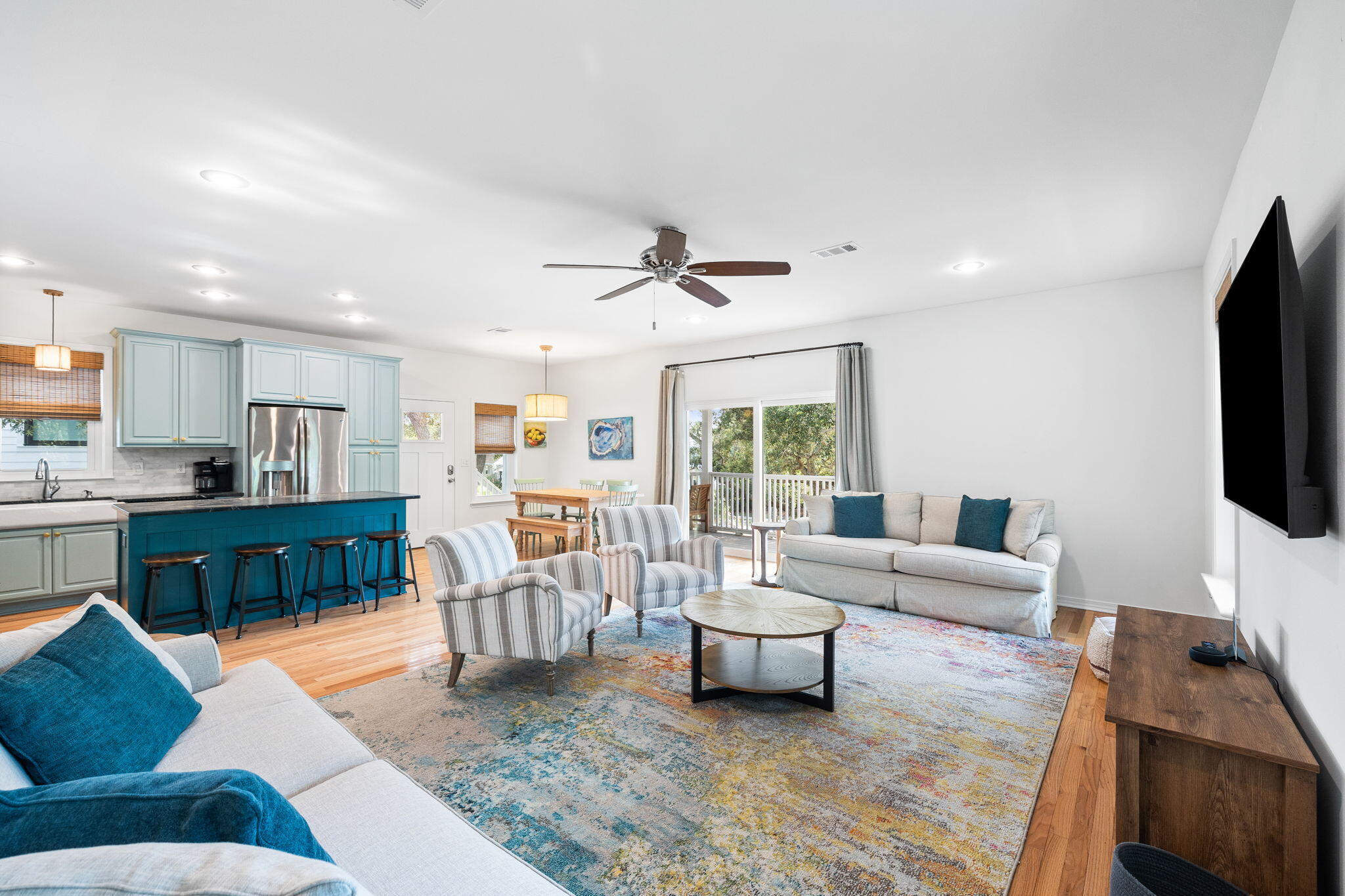 85 Dolphin Street Destin, FL 32541 - Photo 32 of 63 a living room with furniture and a flat screen tv