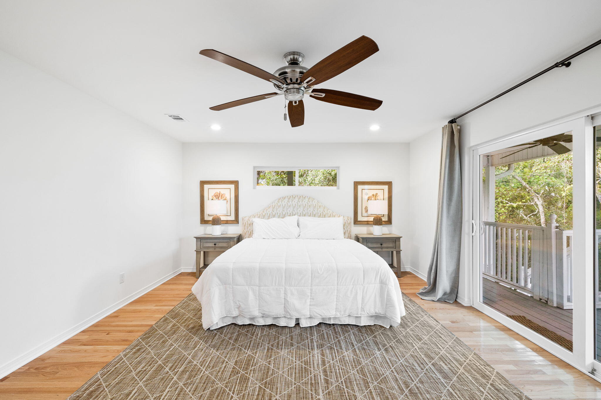 85 Dolphin Street Destin, FL 32541 - Photo 35 of 63 a bedroom with a bed and wooden floor