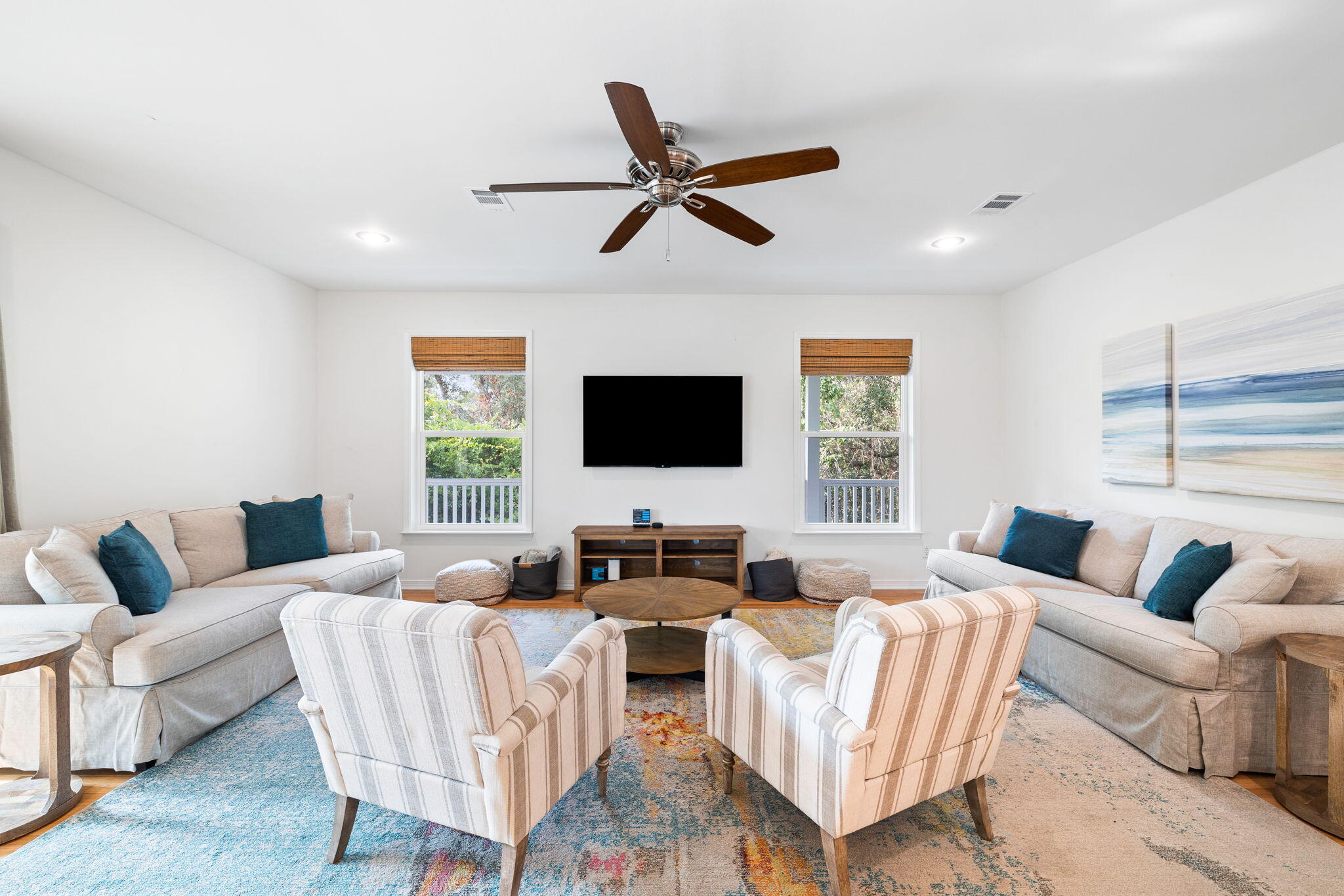 85 Dolphin Street Destin, FL 32541 - Photo 4 of 63 a living room with furniture a window and a flat screen tv