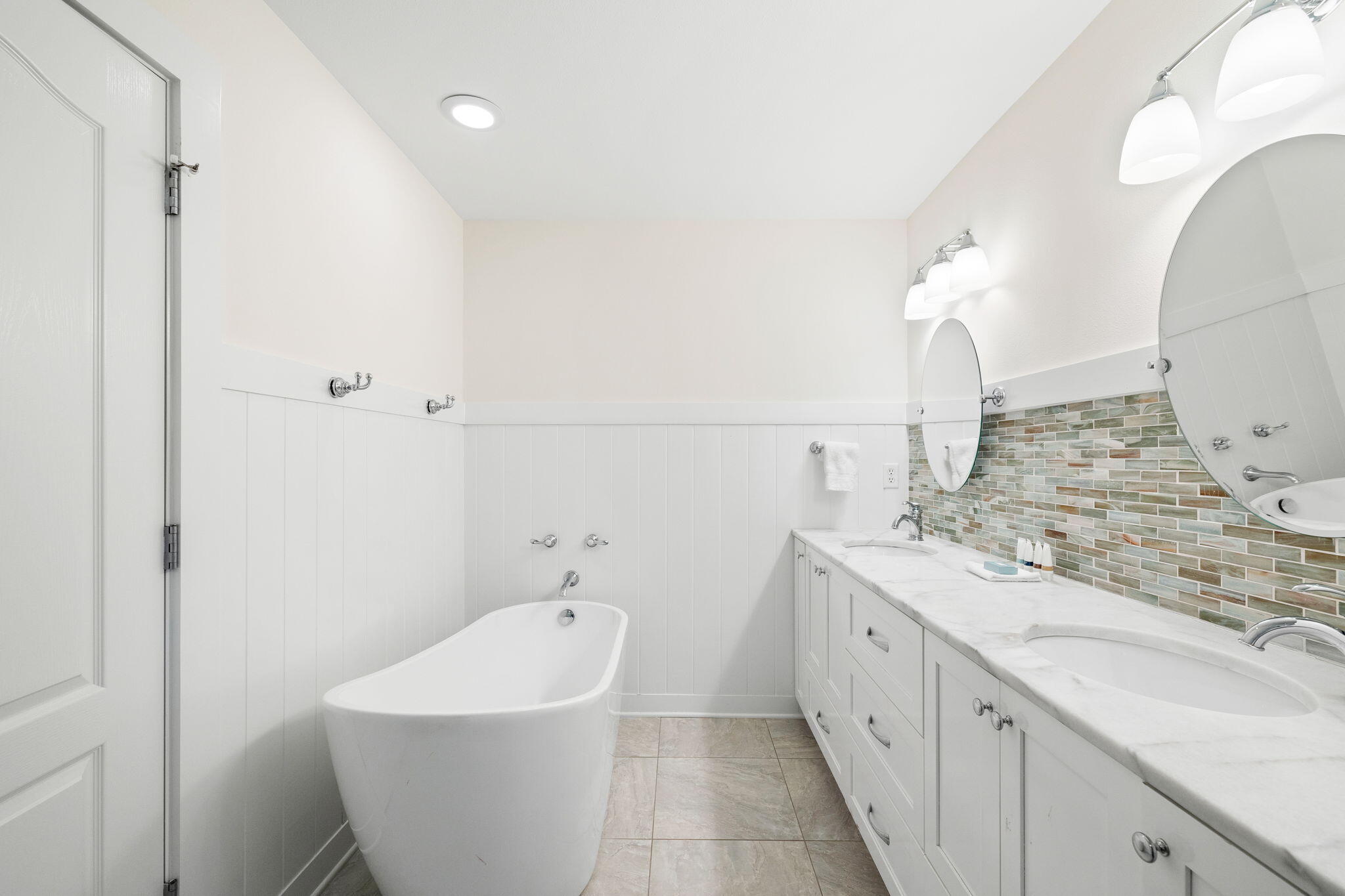85 Dolphin Street Destin, FL 32541 - Photo 41 of 63 a bathroom with a granite countertop sink and a mirror