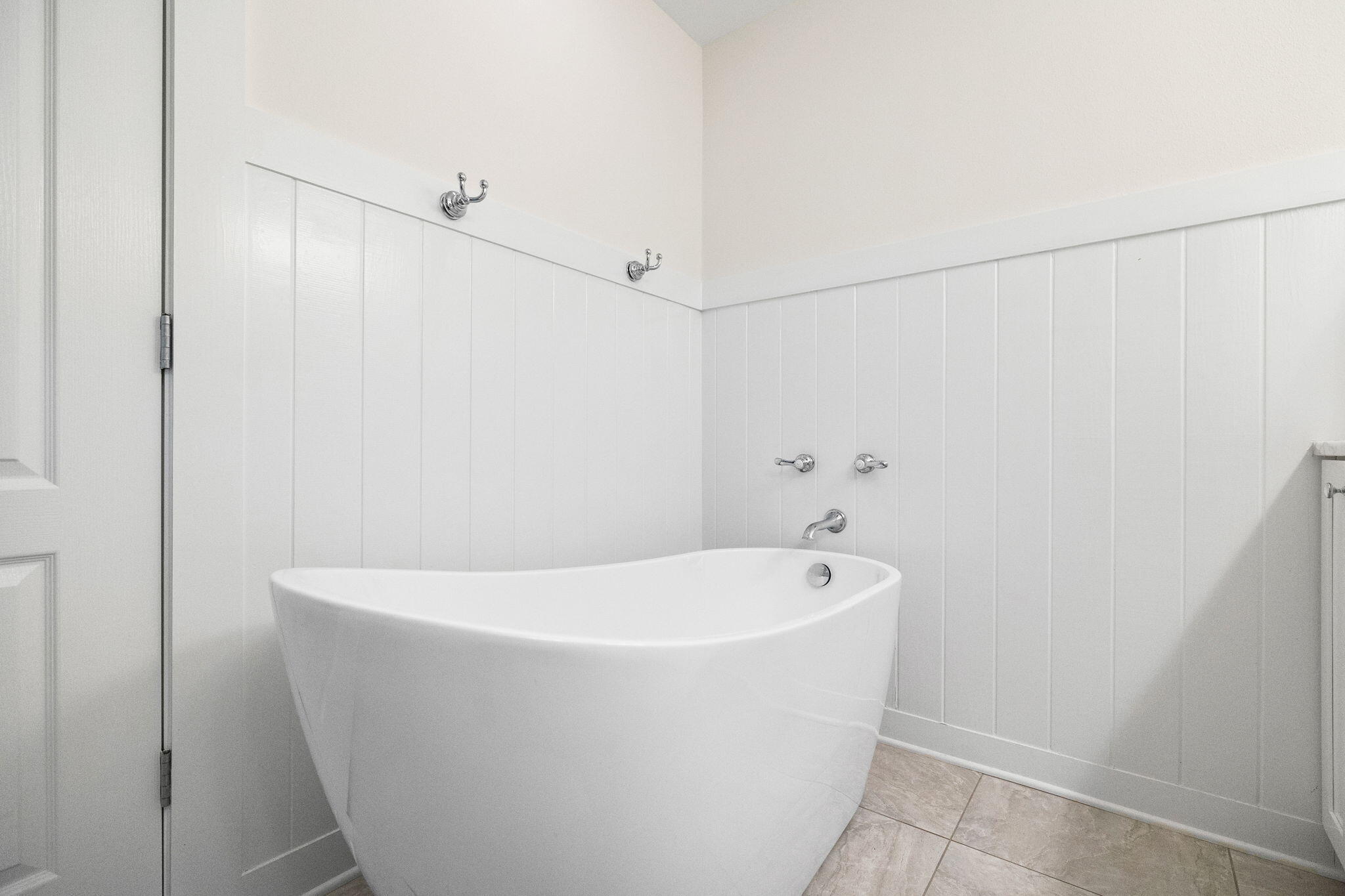 85 Dolphin Street Destin, FL 32541 - Photo 42 of 63 a white tub sitting in a bathroom