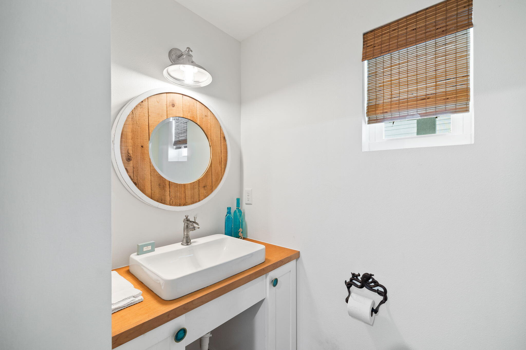 85 Dolphin Street Destin, FL 32541 - Photo 45 of 63 a bathroom with a sink and a mirror