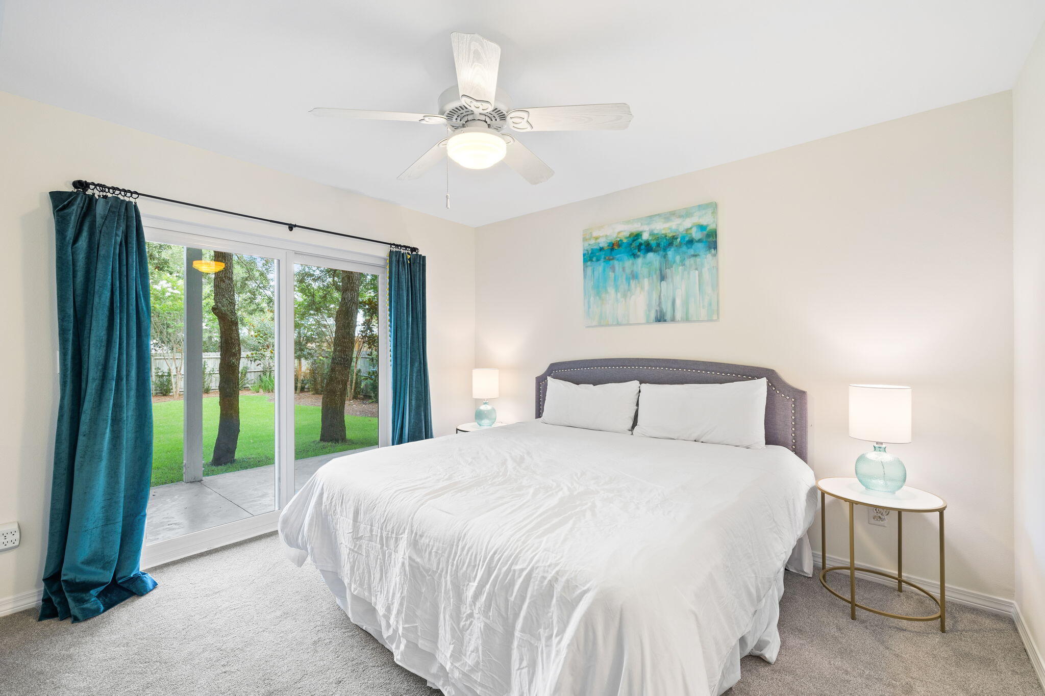 85 Dolphin Street Destin, FL 32541 - Photo 47 of 63 a bedroom with a large bed and a chandelier