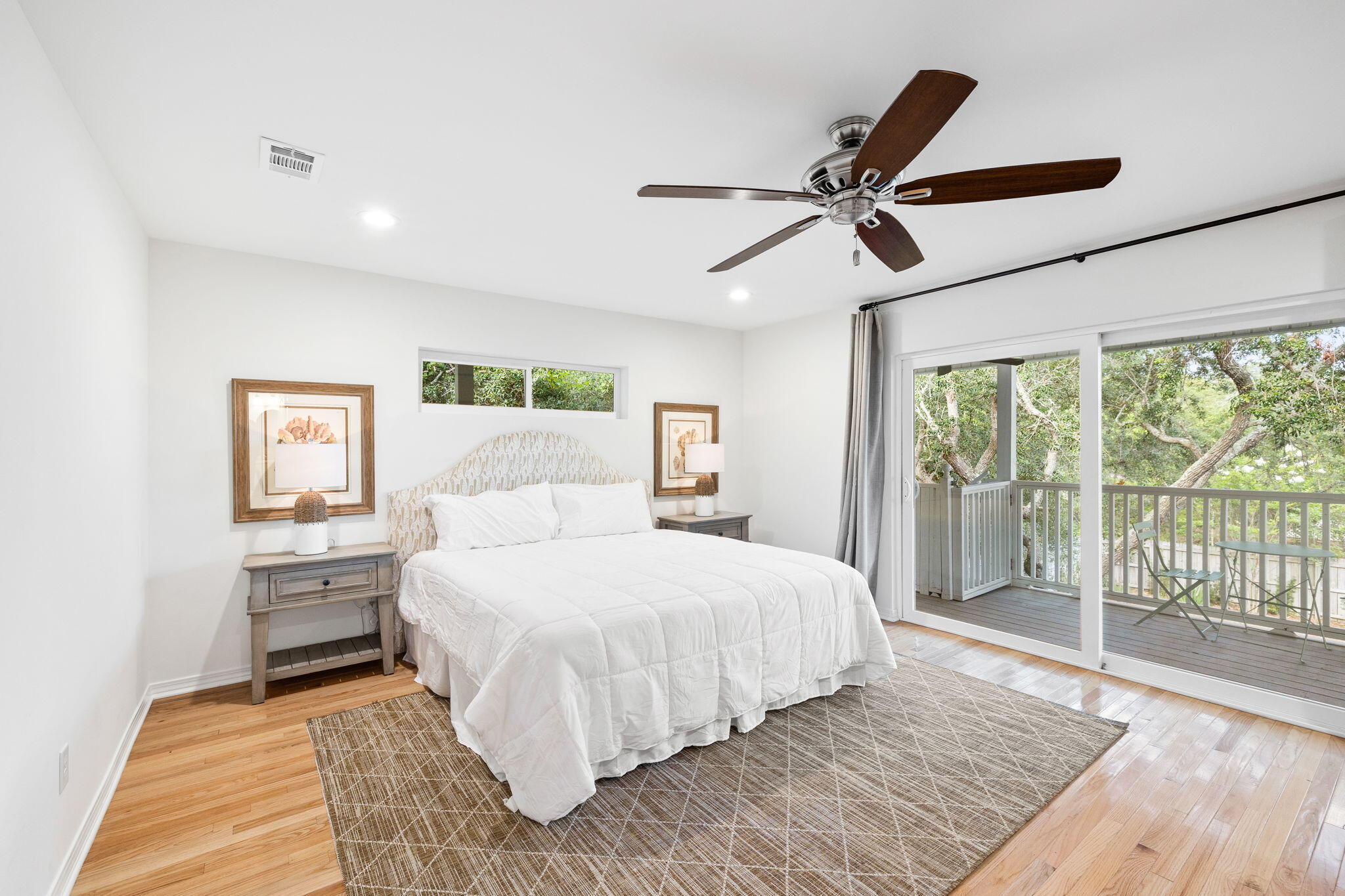 85 Dolphin Street Destin, FL 32541 - Photo 5 of 63 a bedroom with a large bed and a chandelier