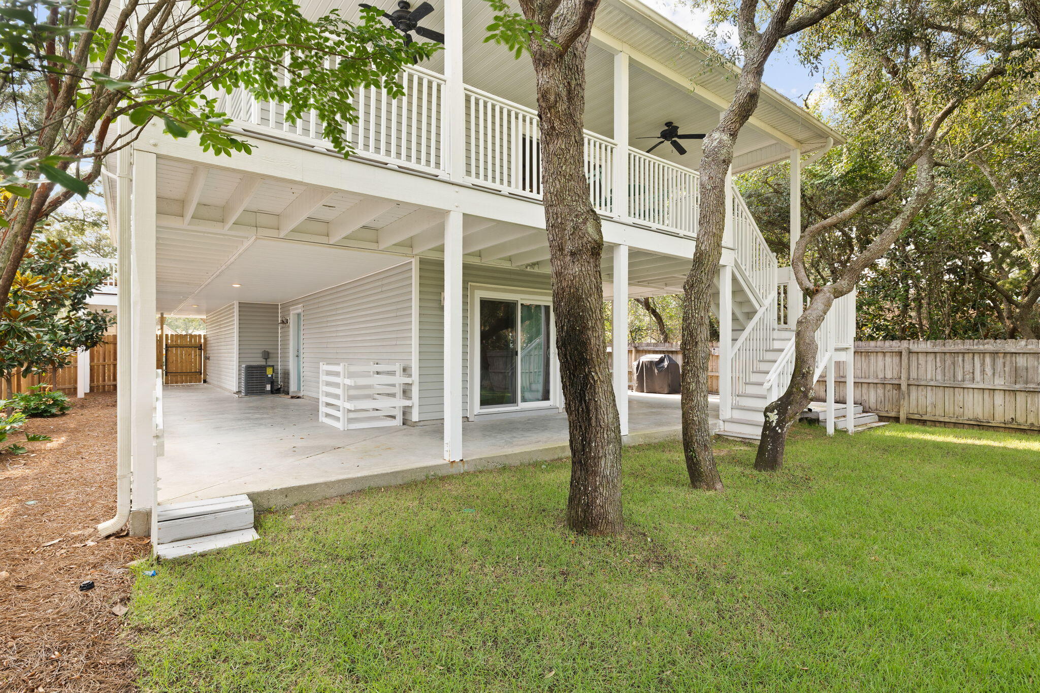 85 Dolphin Street Destin, FL 32541 - Photo 53 of 63 front view of a house with a yard