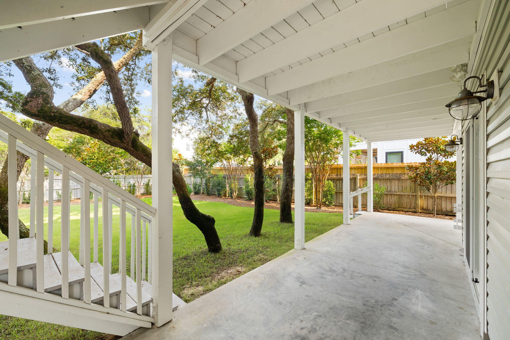 85 Dolphin Street Destin, FL 32541 - Photo 54 of 63 a view of a porch with furniture and front door
