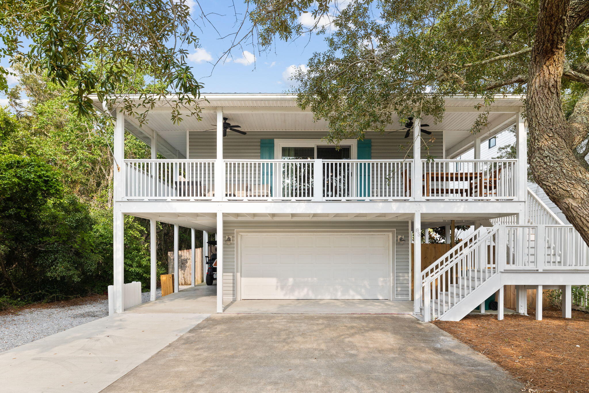 85 Dolphin Street Destin, FL 32541 - Photo 8 of 63 a front view of a house with a balcony