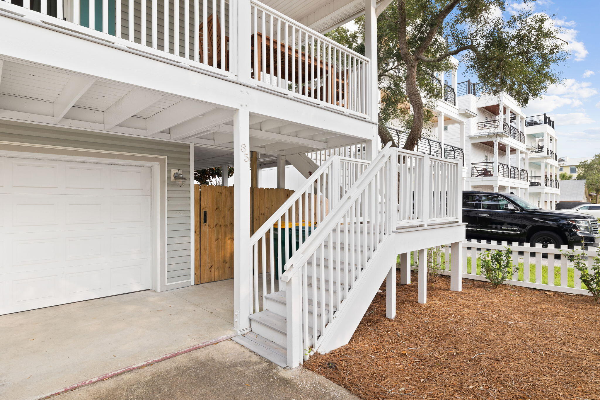 85 Dolphin Street Destin, FL 32541 - Photo 9 of 63 a view of a house with wooden fence
