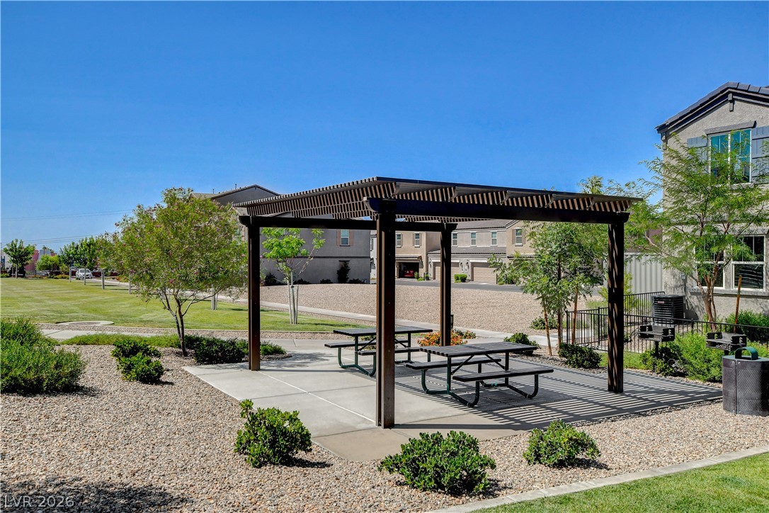 484 Filaree Place Henderson, NV 89015 - Photo 64 of 71 Enjoy outdoor dining and relaxation in this charming community space with mature landscaping.