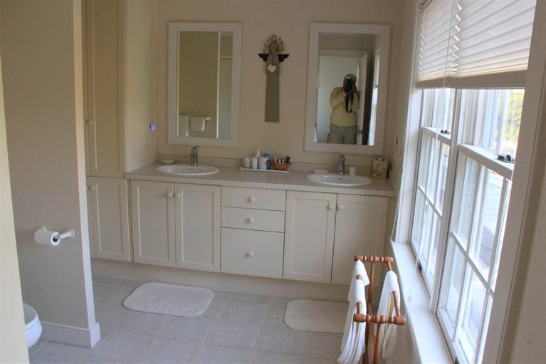 46 Lookout Road Yarmouth Port, MA 02675 - Photo 31 of 35 a bathroom with a sink a toilet and a mirror