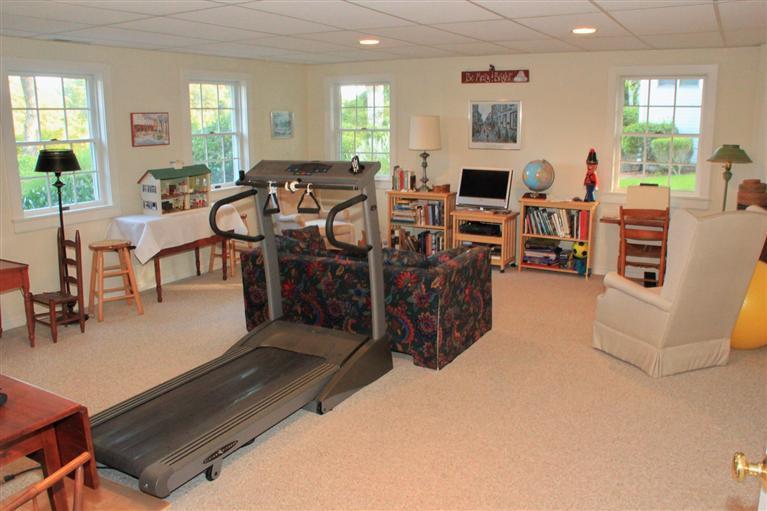 46 Lookout Road Yarmouth Port, MA 02675 - Photo 34 of 35 a living room with furniture a flat screen tv and a large window