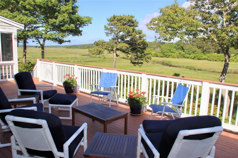 46 Lookout Road Yarmouth Port, MA 02675 - Photo 7 of 35 a balcony with wooden floor table and chairs