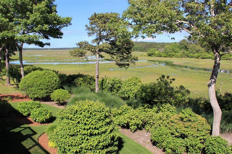 46 Lookout Road Yarmouth Port, MA 02675 - Photo 9 of 35 a view of a lake with a beach