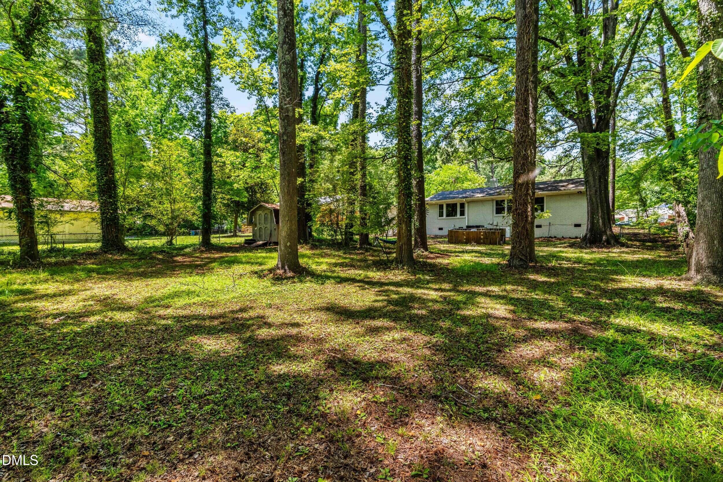 3724 Randell Road Garner, NC 27529 - Photo 31 of 32 a view of outdoor space with deck and tree