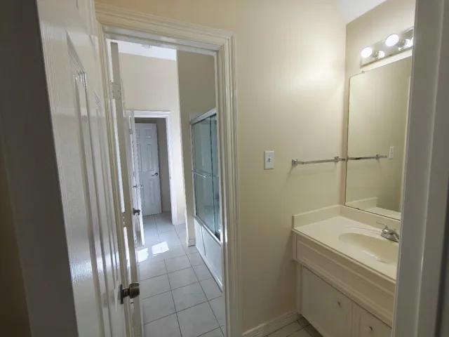 a workspace with a wooden floor and a window