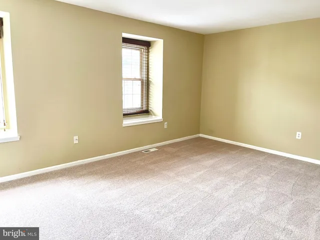 an empty room with a windows
