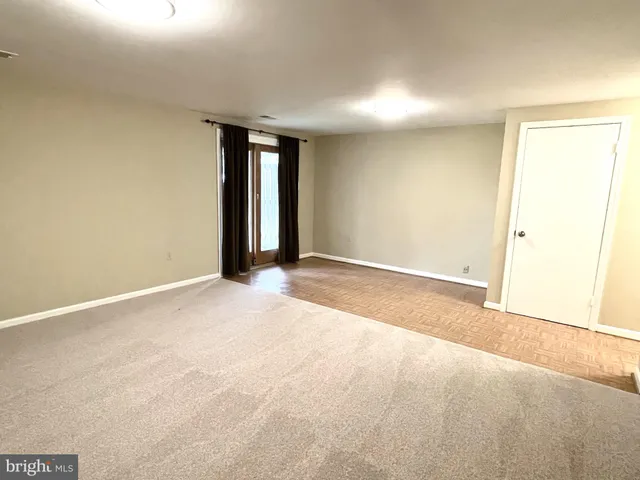 a view of an empty room and window