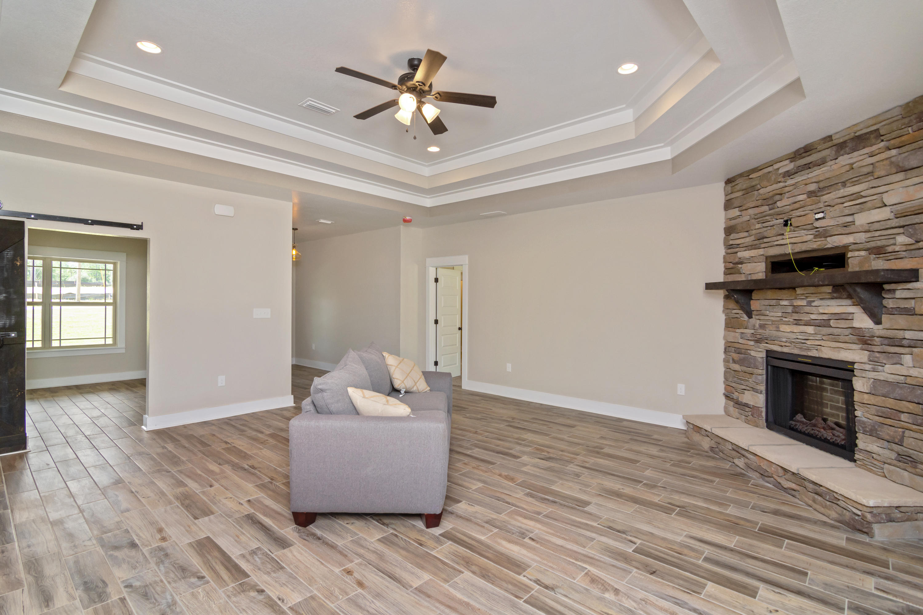4070 Happy Trails Road Crestview, FL 32539 - Photo 3 of 34 a living room with furniture and a fireplace