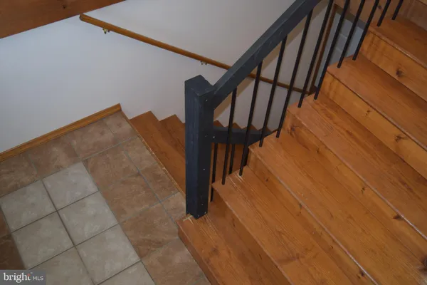 a view of stairs and with wooden floor