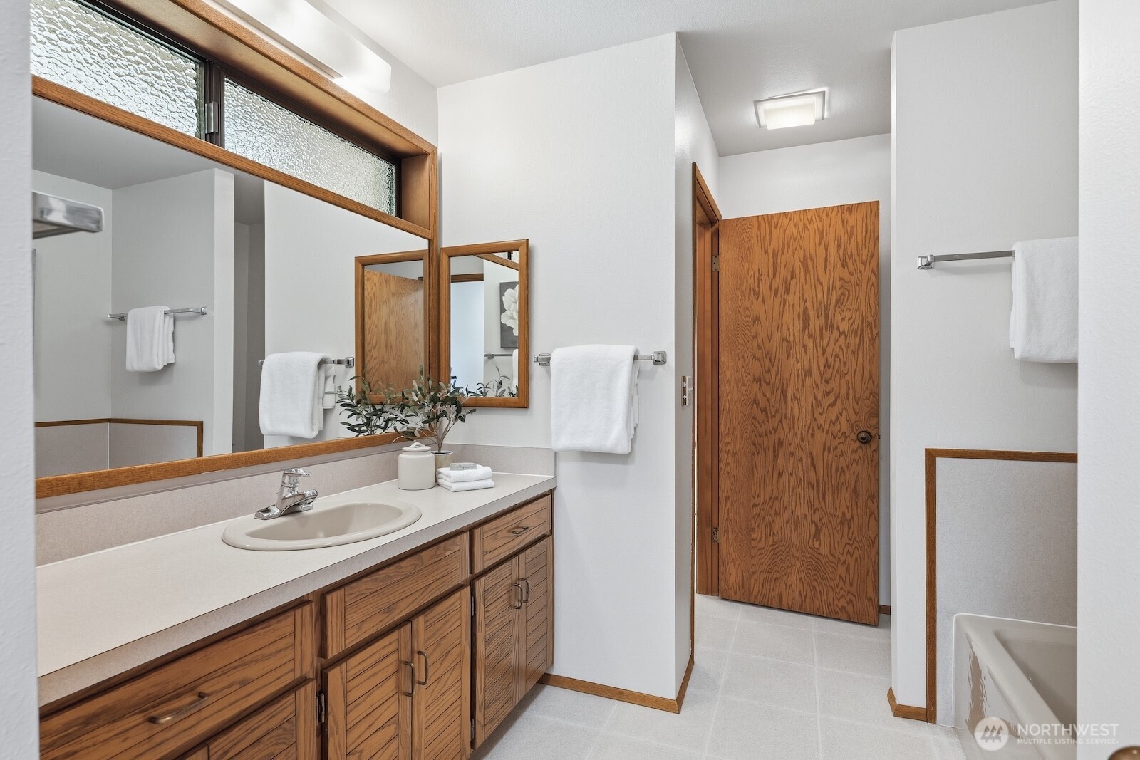 30130 Southeast Issaquah-Fall City Road Fall City, WA 98024 - Photo 18 of 39 a bathroom with a sink a mirror and a shower