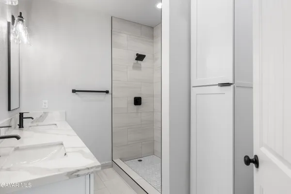 a bathroom with a sink and a shower