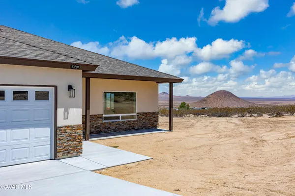a view of large house with a yard