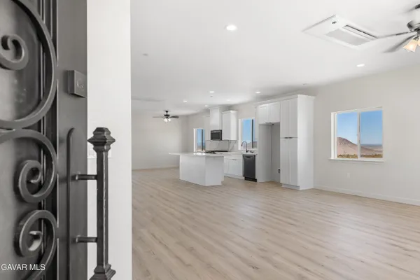 a view of a kitchen with refrigerator and washer