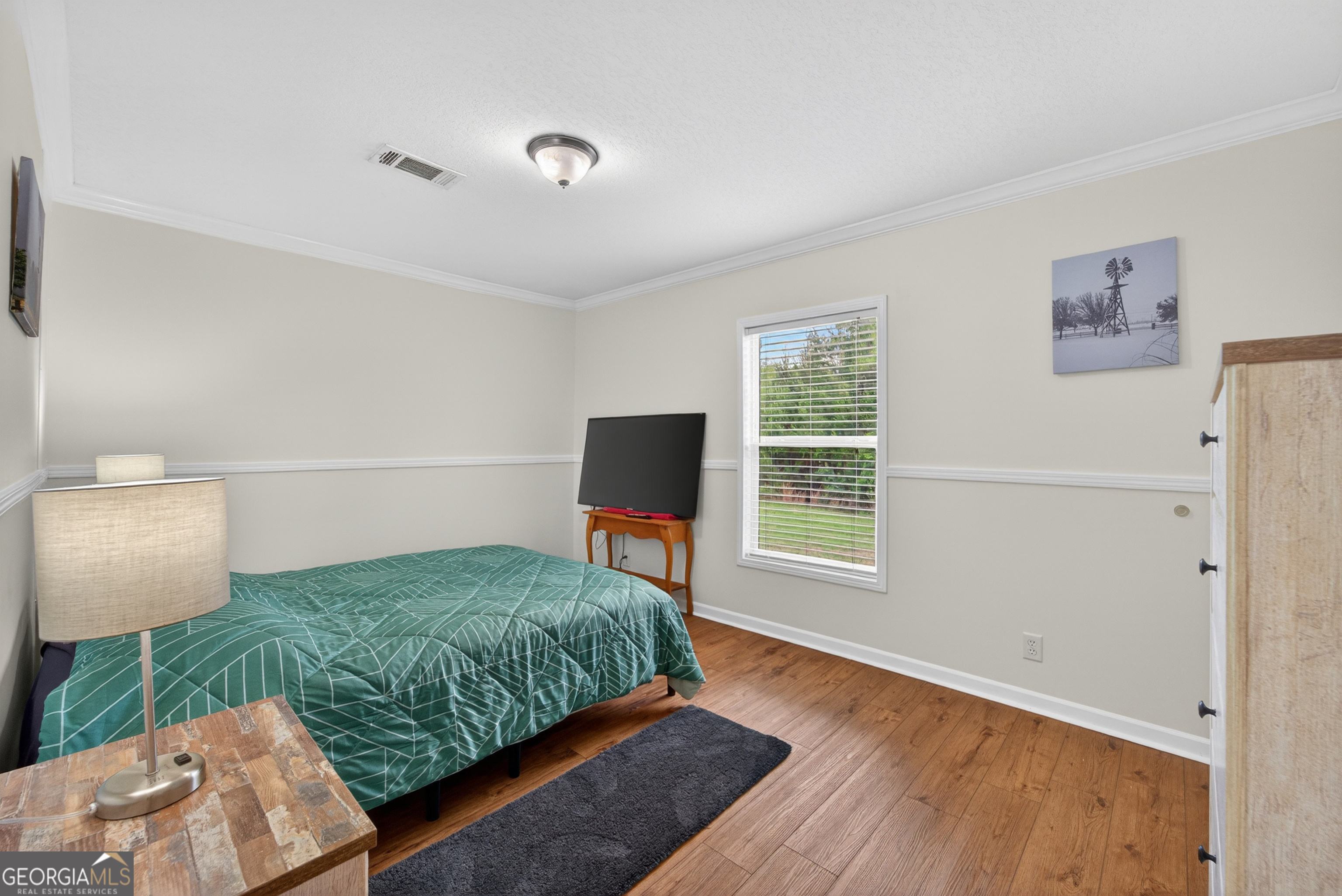 1953 Raybon Road West Hoboken, GA 31542 - Photo 21 of 31 a bedroom with furniture and a window
