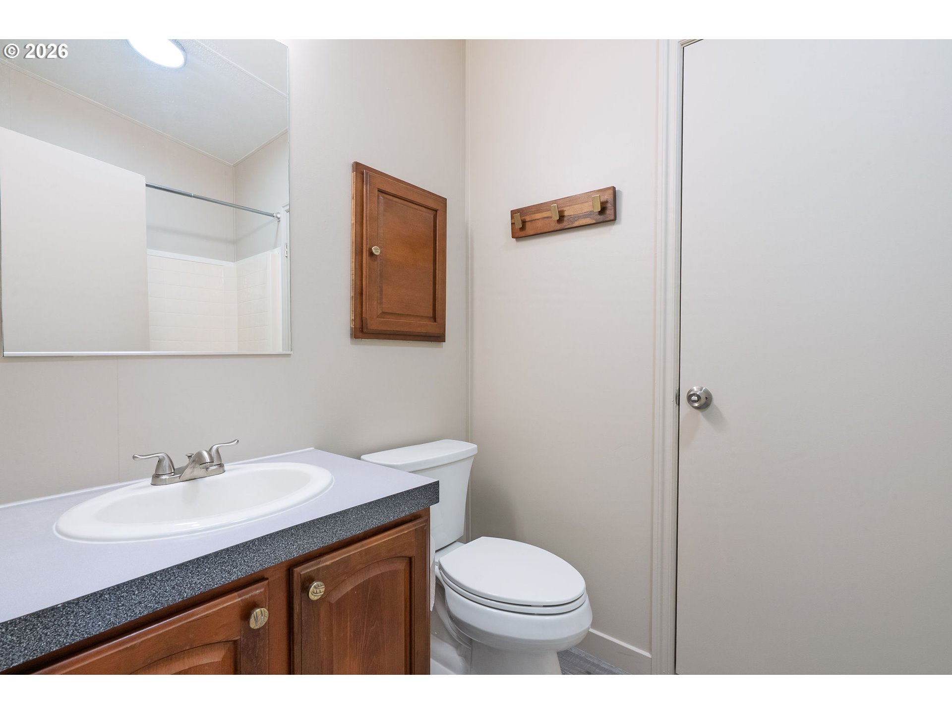 11105 Main Street Northeast Donald, OR 97020 - Photo 18 of 22 a bathroom with a sink mirror and toilet