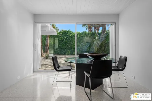 a view of living room with a large window and table