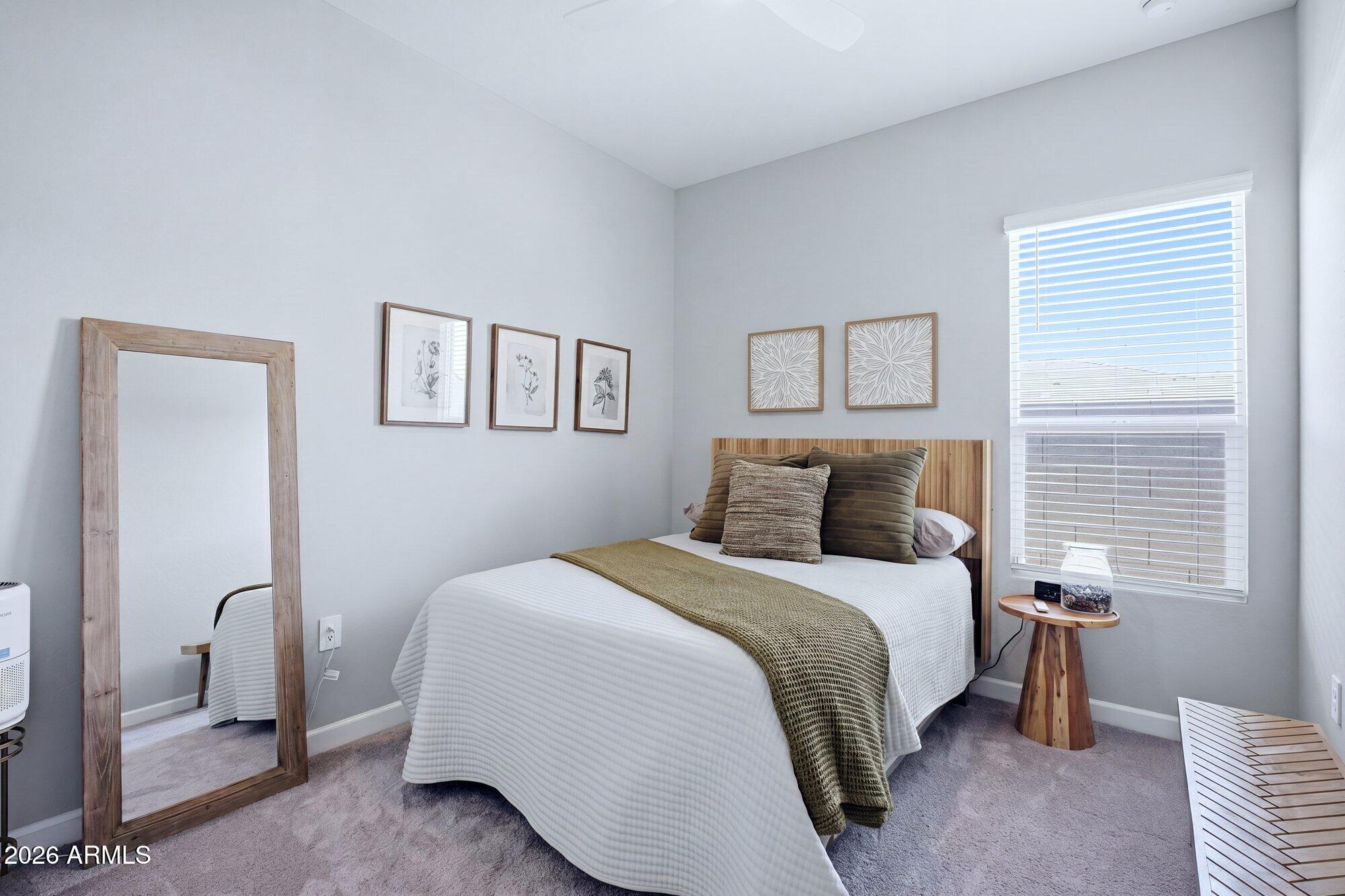 5963 East Lone Cactus Road Phoenix, AZ 85054 - Photo 11 of 22 a bedroom with a bed and a painting on the wall
