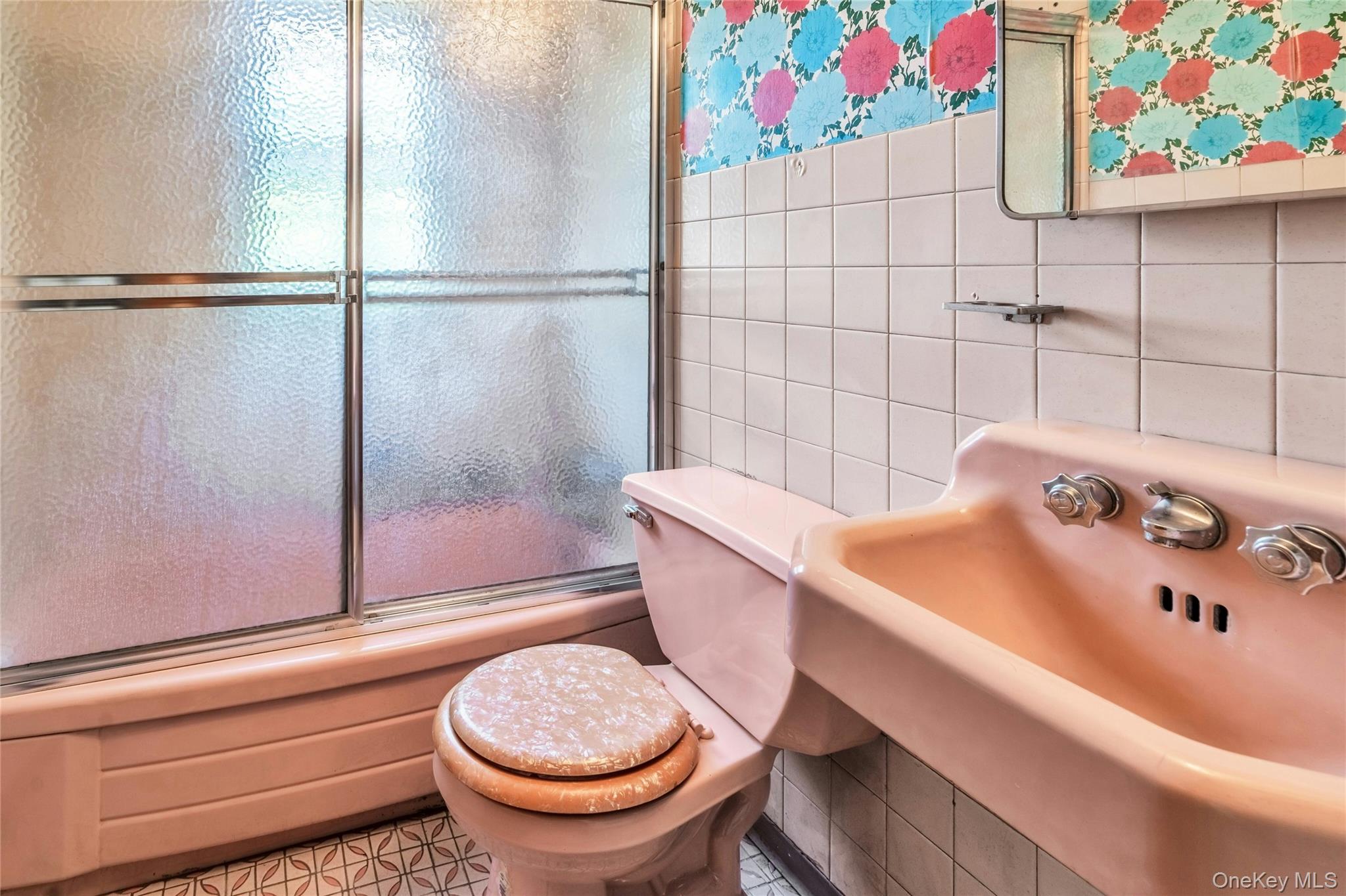 42 Summit Street Plainview, NY 11803 - Photo 17 of 22 a bathroom with a sink toilet and shower