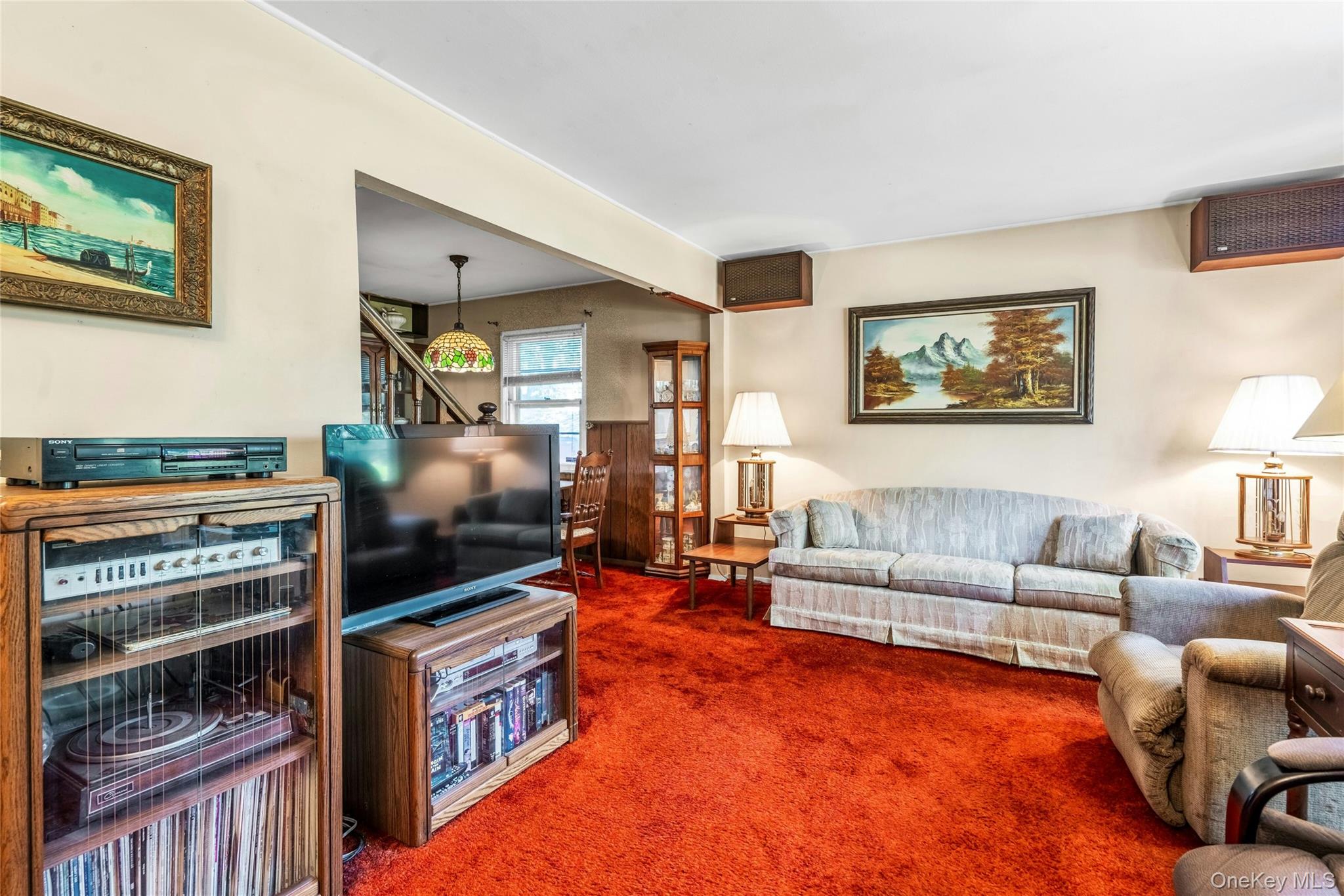 42 Summit Street Plainview, NY 11803 - Photo 6 of 22 a living room with furniture and a flat screen tv