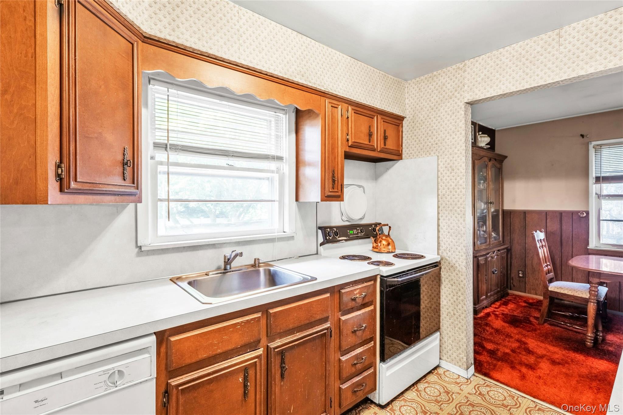42 Summit Street Plainview, NY 11803 - Photo 9 of 22 a kitchen that has a sink and a stove in it