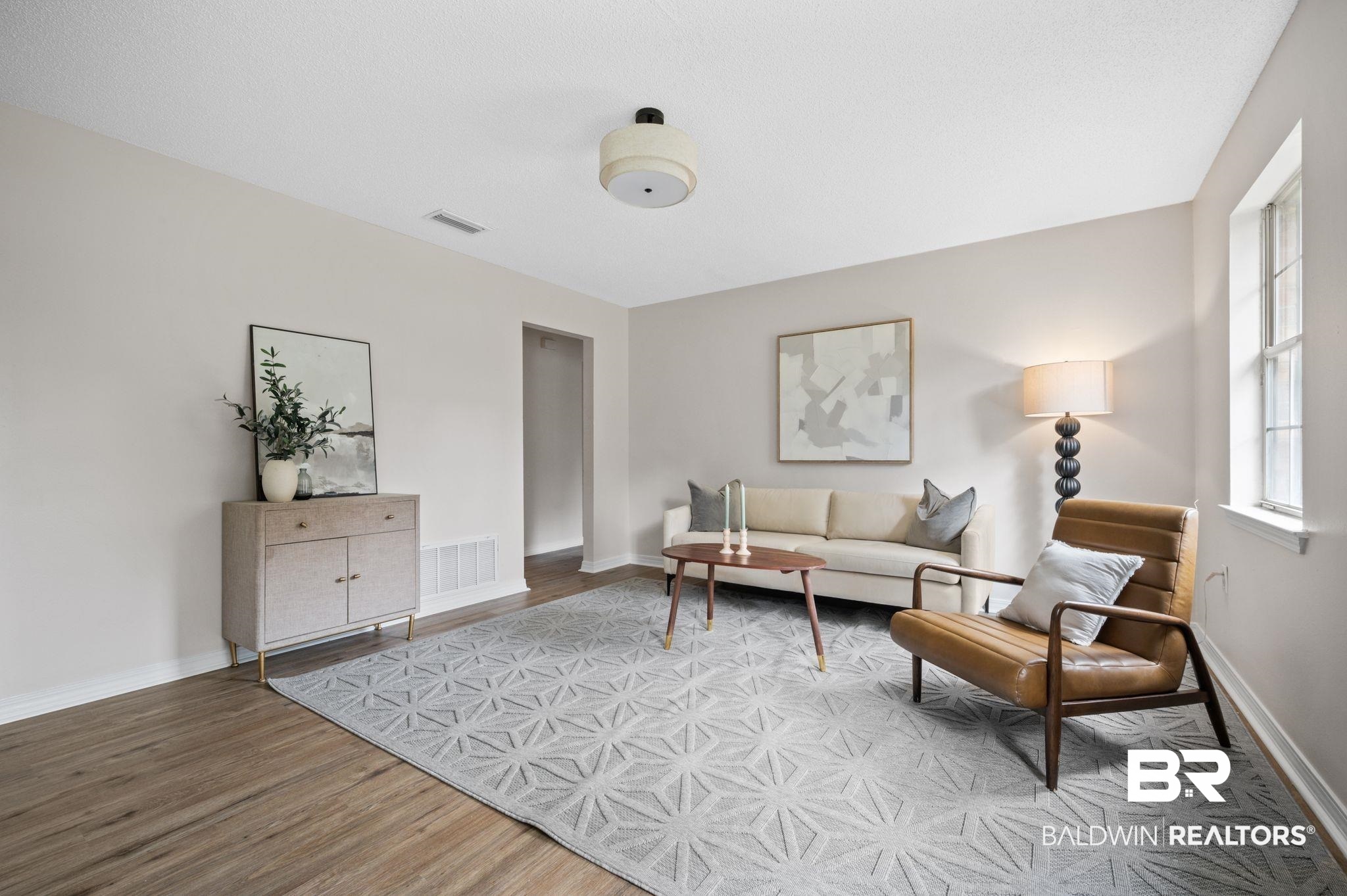 811 East Verbena Avenue Foley, AL 36535 - Photo 2 of 16 Living room featuring wood-type flooring