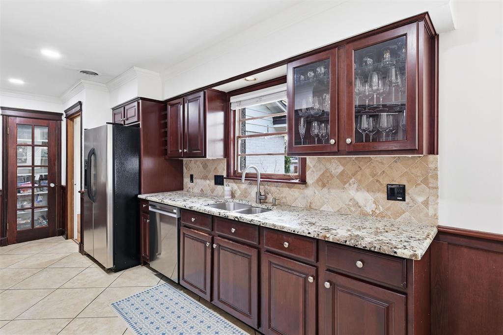6724 Kirkwood Road Fort Worth, TX 76116 - Photo 20 of 40 a kitchen with stainless steel appliances granite countertop a refrigerator and a sink