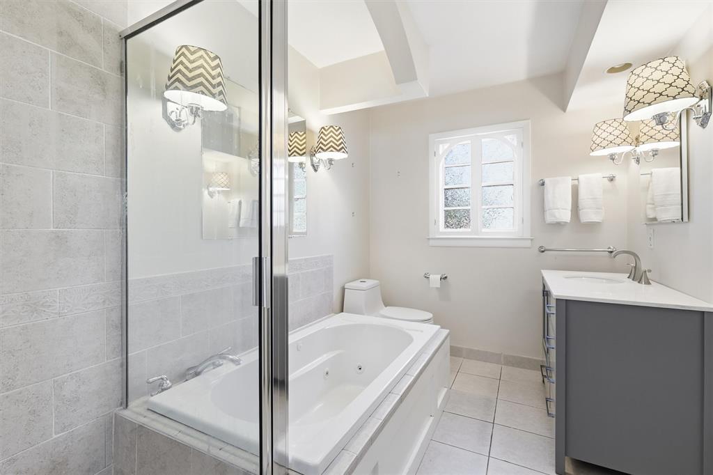 6724 Kirkwood Road Fort Worth, TX 76116 - Photo 29 of 40 a bathroom with a tub shower and sink